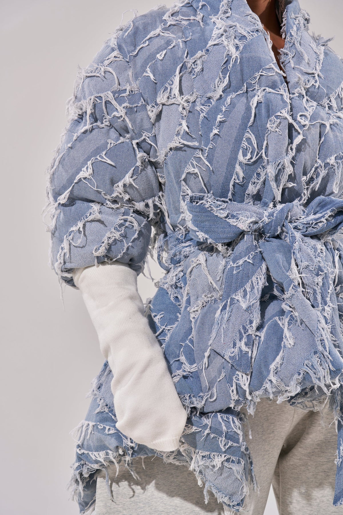 RIB SLEEVE PEPLUM PUFFER IN DENIM