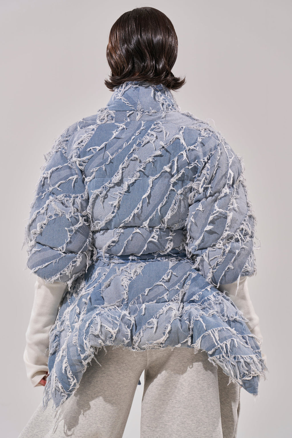 RIB SLEEVE PEPLUM PUFFER IN DENIM