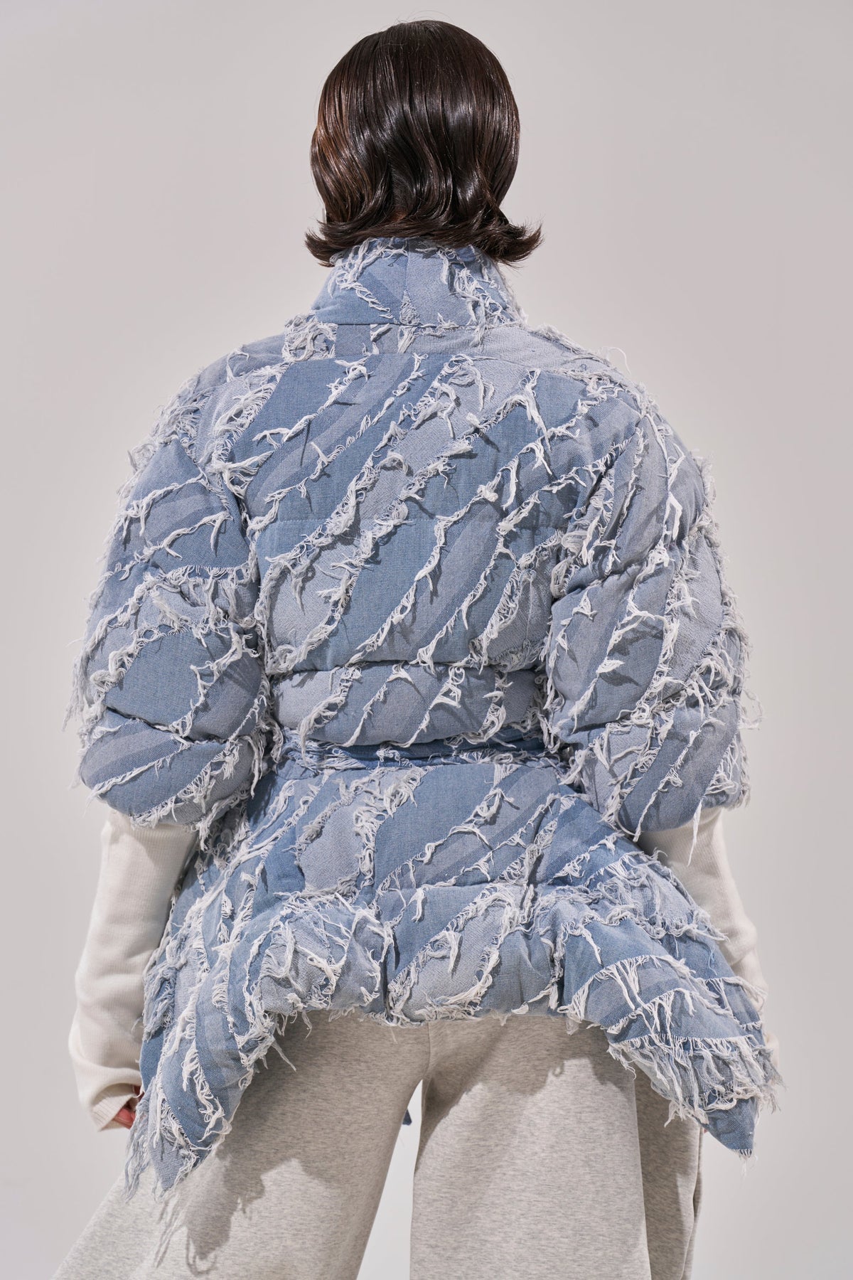 RIB SLEEVE PEPLUM PUFFER IN DENIM